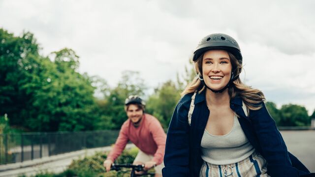 Savings brand images - young woman and man bicycling - small